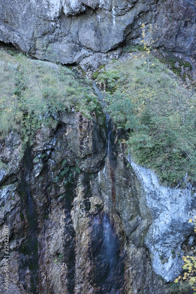 Tiny waterfall at mountain face