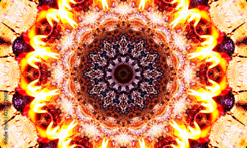 Burning orange mandala Art with kaleidoscopic flames and shapes.
