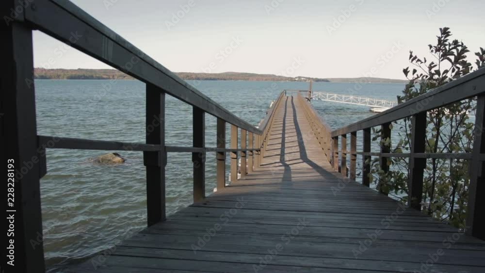 Pier perspective leading out to dock in Maine harbor Pier perspective leading out to dock in Maine harbor