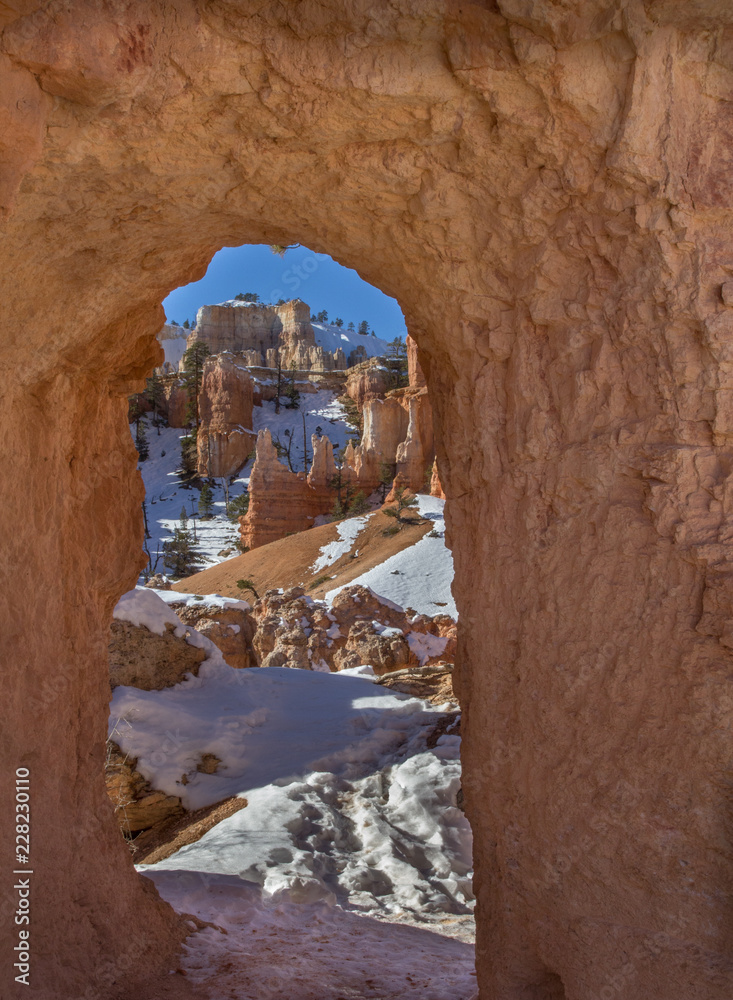 Snowy winter day in the orange canyon of Bryce National Park, Utah