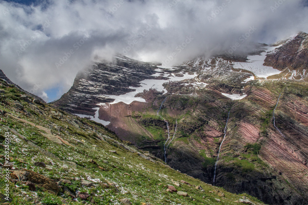 Snow dusted vista of Gunsight pass in Glacier National Park at the