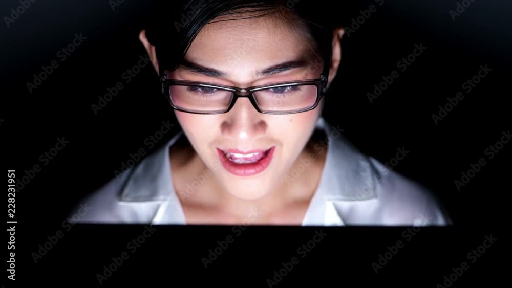 Woman working late at her home office. Close up of beautiful asian woman talking to customer using video call in computer, wearing glasses, happy mood. Modern global connected business concept. Woman working late at her home office. Close up of beautiful asian woman talking to customer using video call in computer, wearing glasses, happy mood. Modern global connected business concept.
