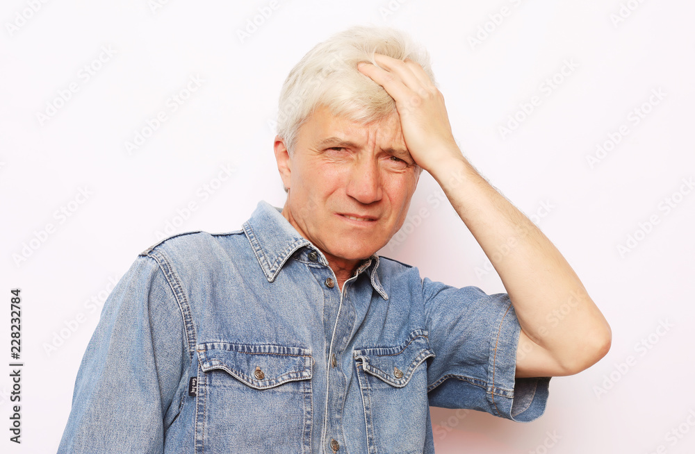 lifestyle, health and people concept: Senior man has headache, on white background lifestyle, health and people concept: Senior man has headache, on white background