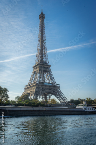 Paris, France - 10 13 2018: The Eiffel Tower from the quays of Seine, at sunrise