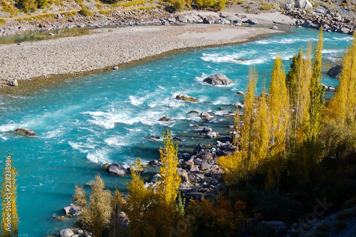 Turquoise water flowing along the Gilgit river in Gupis  Ghizer  Gilgit-Baltistan  Pakistan.