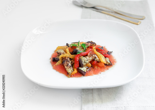 Salad of tomatoes, peppers and roasted aubergine