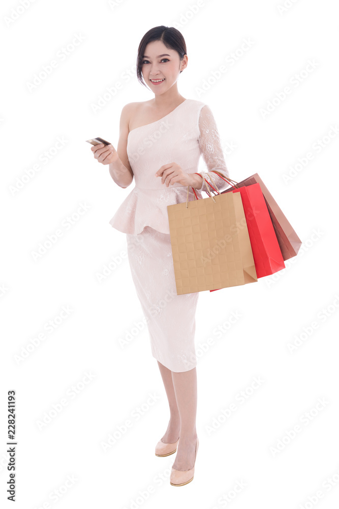 happy woman holding credit card and shopping bag isolated on white background happy woman holding credit card and shopping bag isolated on white background