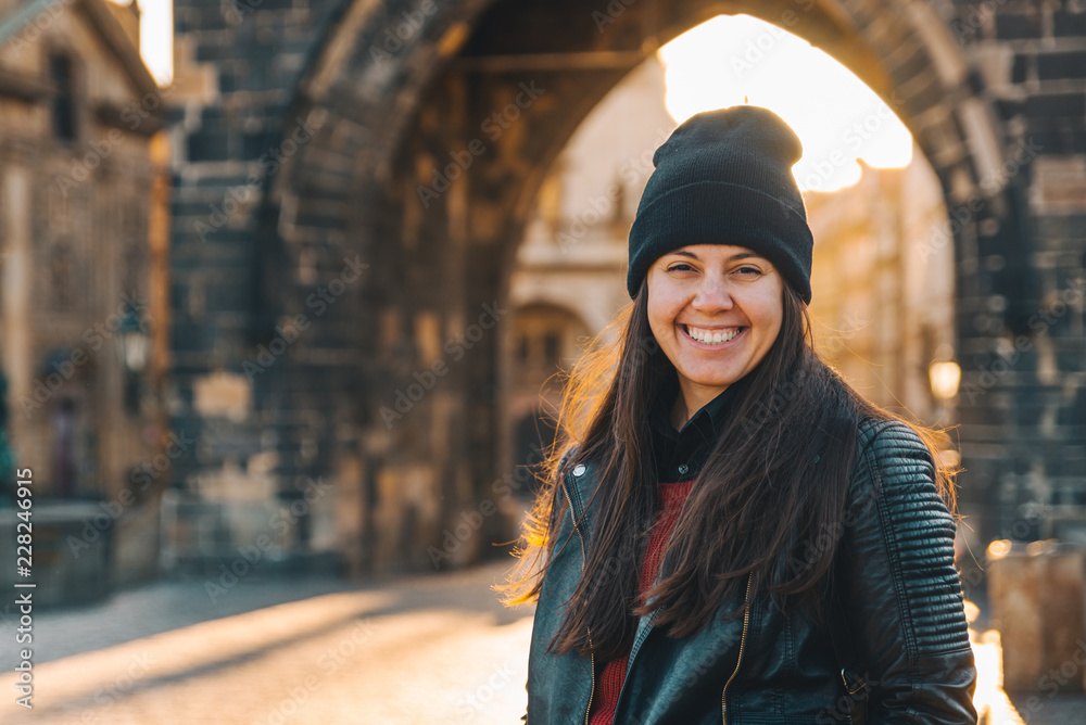 woman portrait at sunrise at charles bridge in prague