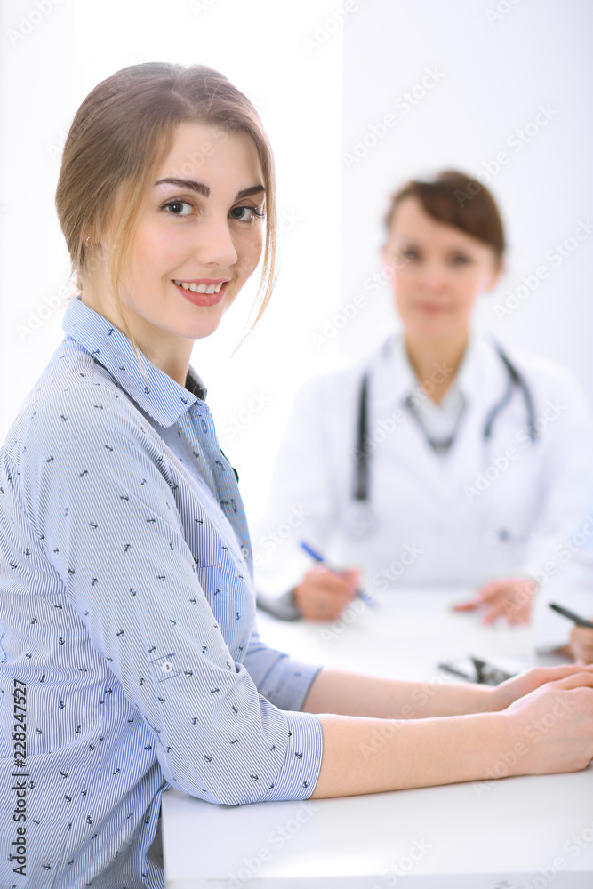 Doctor and patient at meeting. Medicine and health care concept Doctor and patient at meeting. Medicine and health care concept