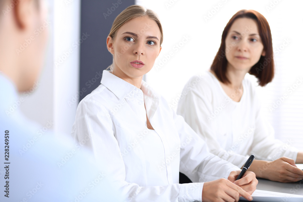 Group of business people or lawyers discussing terms of transaction in office. Meeting and teamwork concept Group of business people or lawyers discussing terms of transaction in office. Meeting and teamwork concept