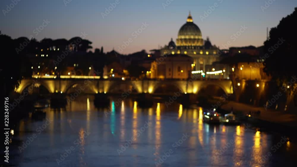 Blurred view of San Pietro near Sant Angelo Bridge across the Tiber River Blurred view of San Pietro near Sant Angelo Bridge across the Tiber River