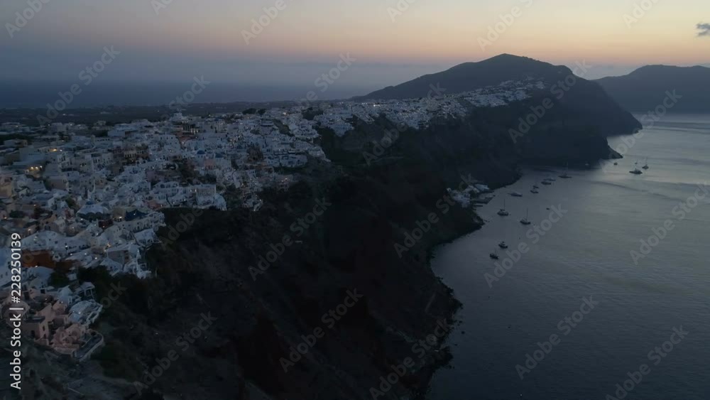 Aerial view flying over city of Oia on Santorini Greece Aerial view flying over city of Oia on Santorini Greece