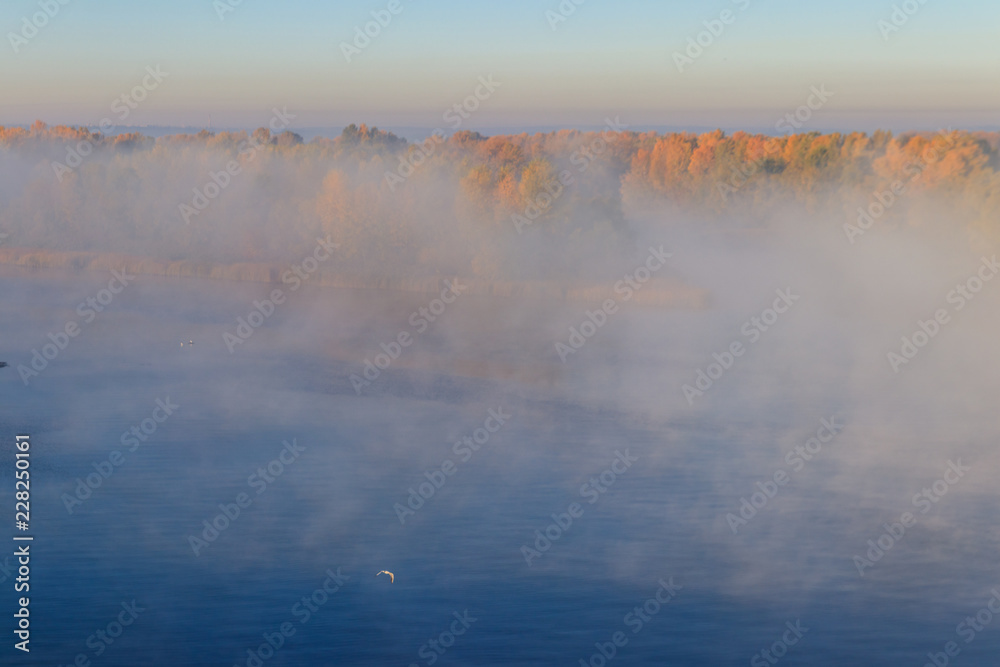 Fototapeta premium View on the Dnieper river in fog in the morning at autumn