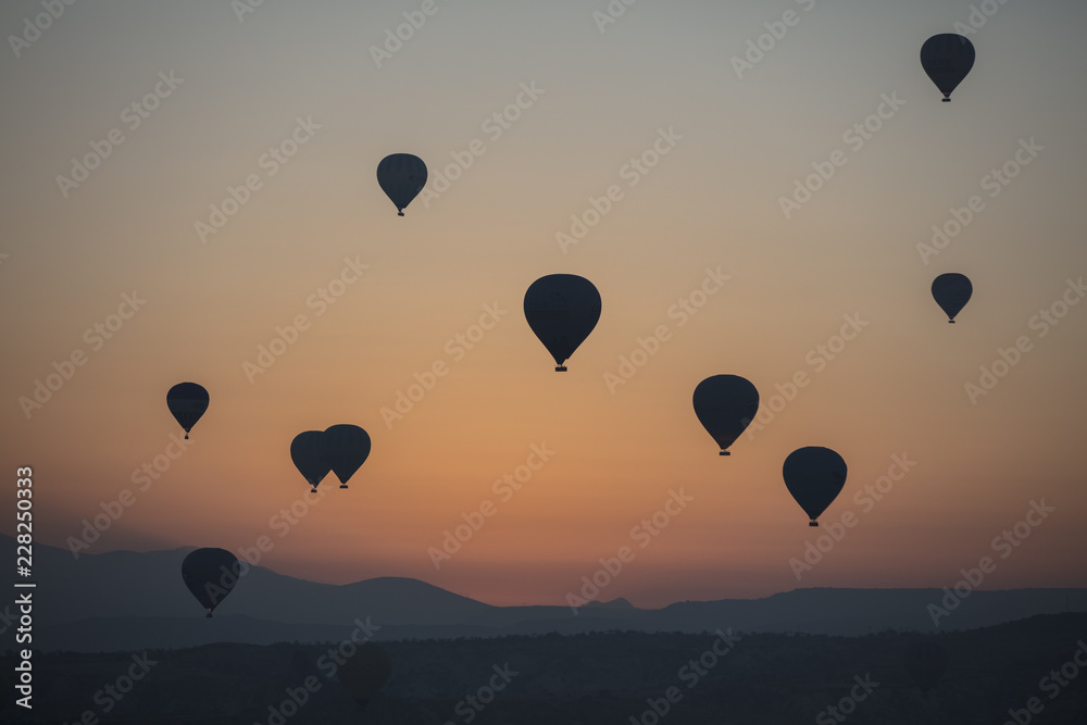 Fototapeta premium Hot air balloon flying over spectacular Cappadocia