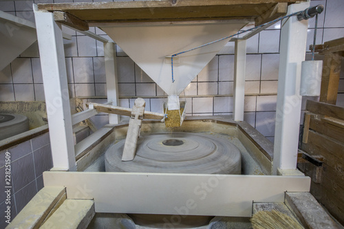 Canvas Print old stone mill still produces flour