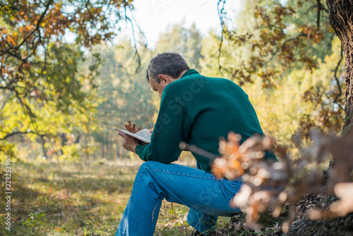 Senior man with a sad philosophical mood worried about something. The concept of life after 50 years, problems and depression. Crisis of middle age 