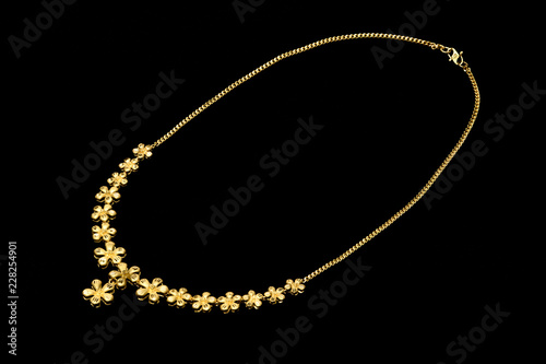 Golden necklace on a black background