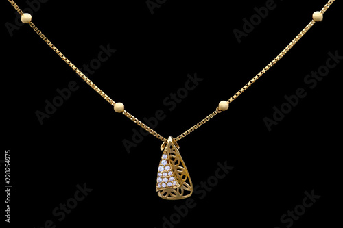 Golden necklace on a black background