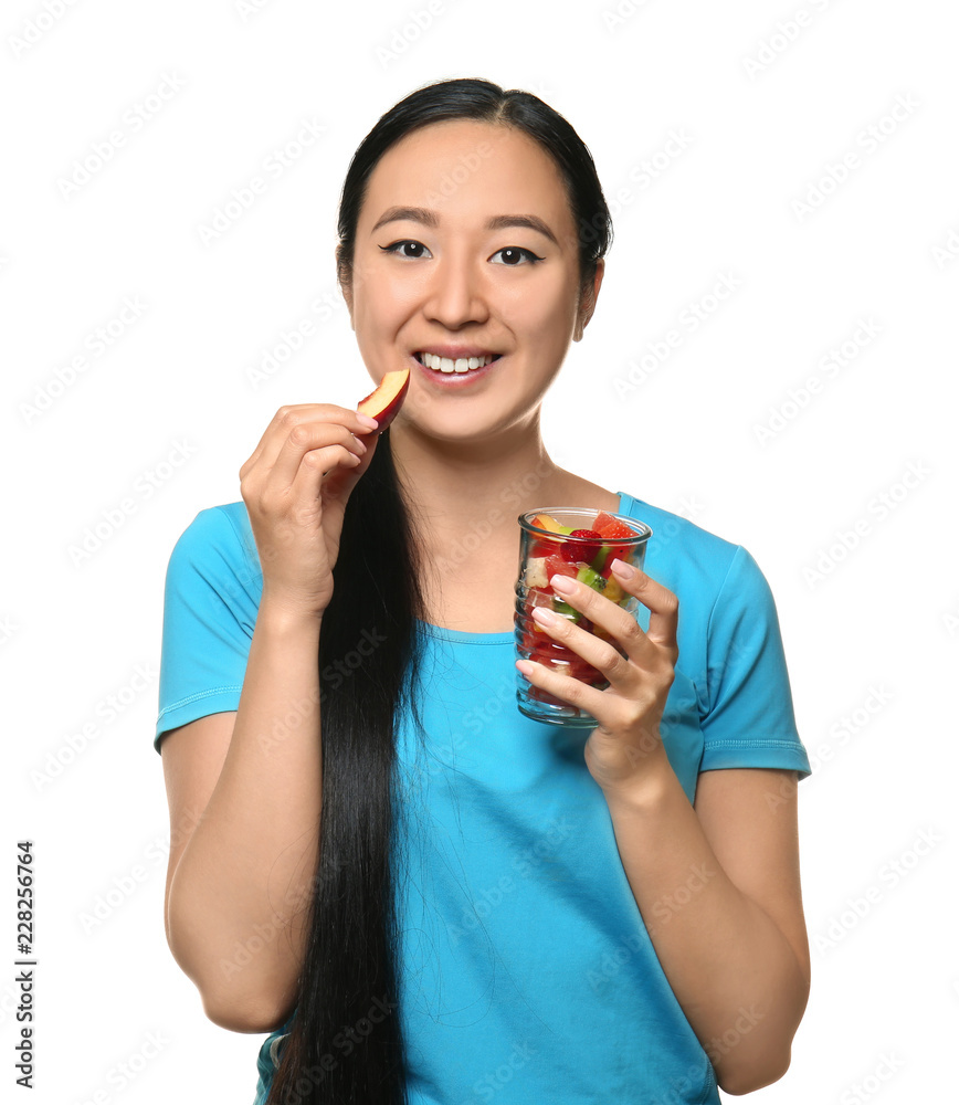 Asian woman with healthy fruit salad on white background Asian woman with healthy fruit salad on white background