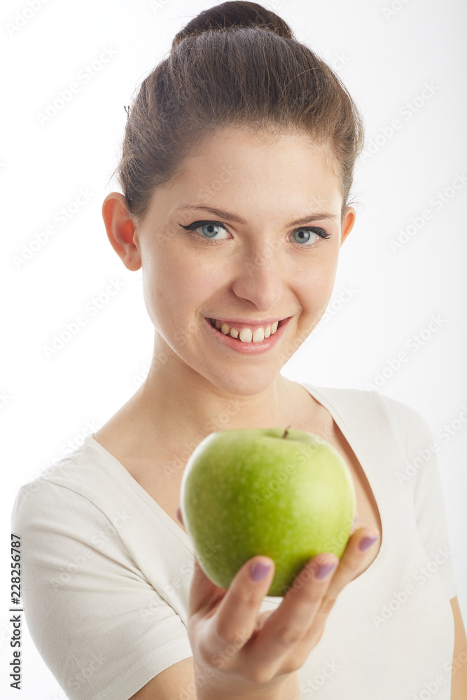 woman holding a green apple woman holding a green apple