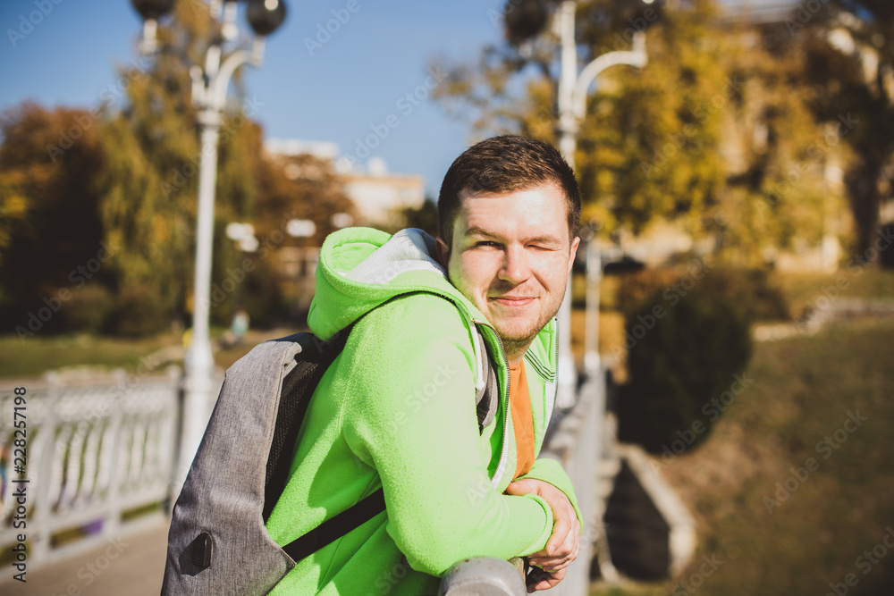 Nice man outdoors portrait. Guy at city streets, smiling people concept, good mood and positive emotions Nice man outdoors portrait. Guy at city streets, smiling people concept, good mood and positive emotions