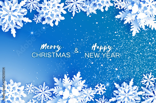 Merry Christmas and Happy New Year Greetings card. White Paper cut snowflakes. Origami Winter Decoration background. Seasonal holidays. Snowfall. Space for text. Blue.