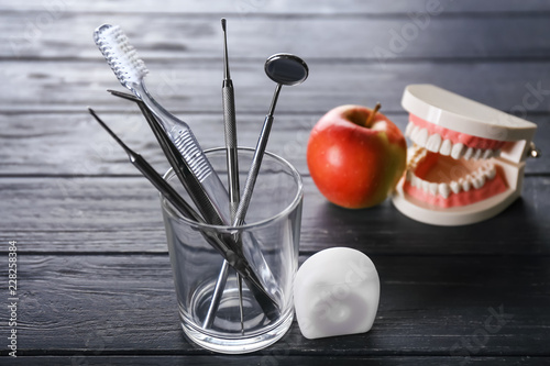 Floss, glass with toothbrus...