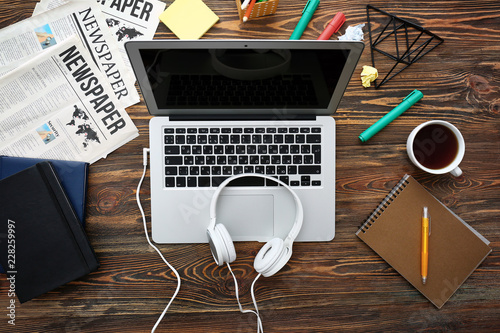 Laptop with headphones on w...