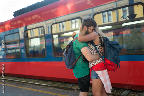 Beautiful couple parting at train station