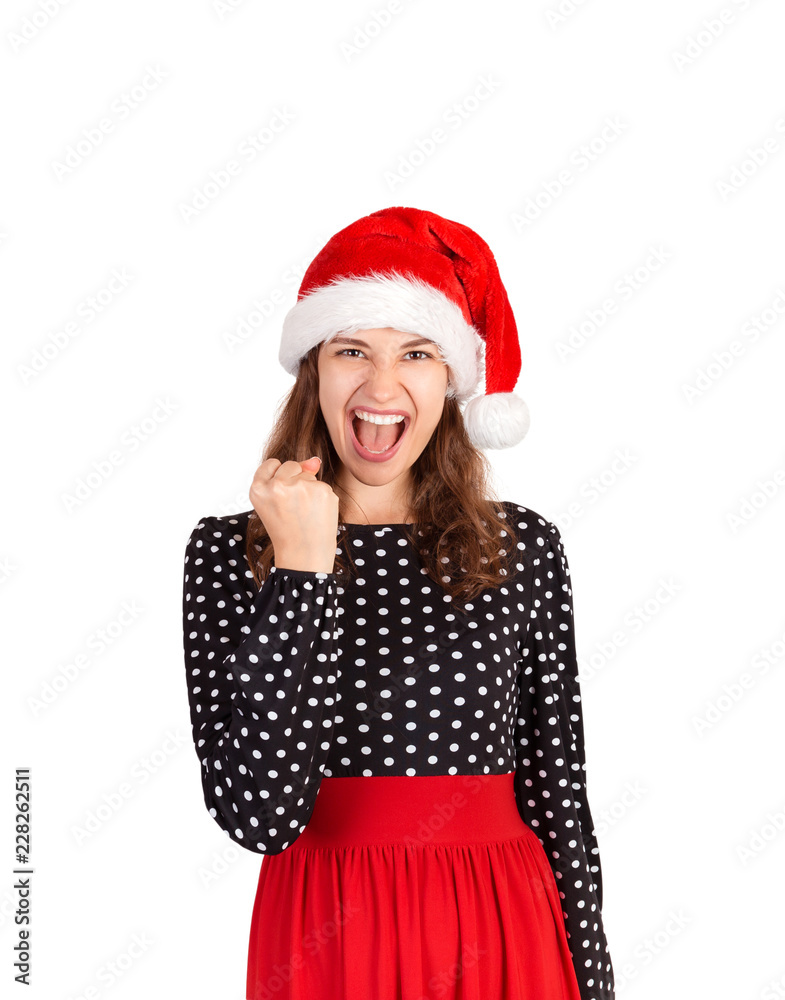 Yeah we did it. portrait of woman in dress celebrating victory, amazed with win. emotional girl in santa claus christmas hat isolated on white background. holiday concept Yeah we did it. portrait of woman in dress celebrating victory, amazed with win. emotional girl in santa claus christmas hat isolated on white background. holiday concept
