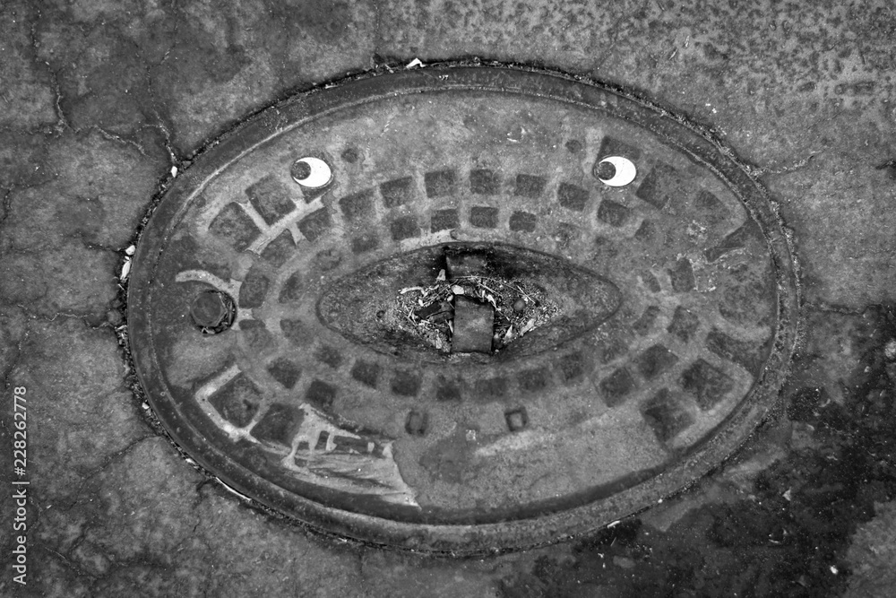 Isolated sewer cover with a comic twist