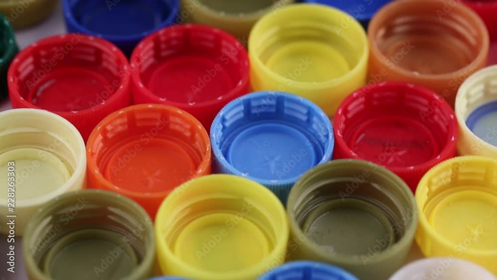 multi-colored plastic bottle caps. recycling used plastic. environment protection multi-colored plastic bottle caps. recycling used plastic. environment protection