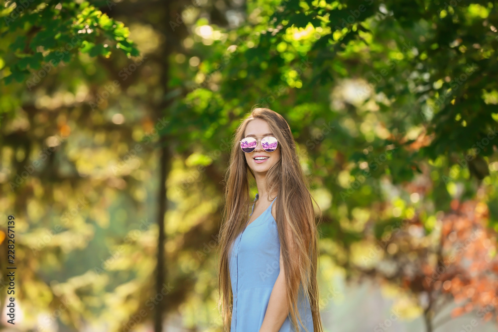 Beautiful young woman resting outdoors
