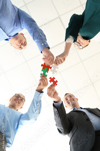Business team with pieces o...