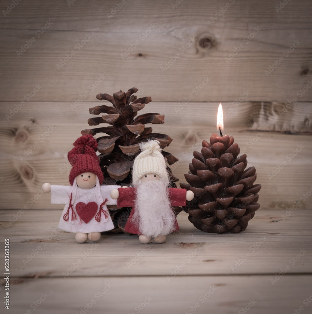 Obraz premium Merry Christmas - Tiny Christmas Figurines & Wooden Background