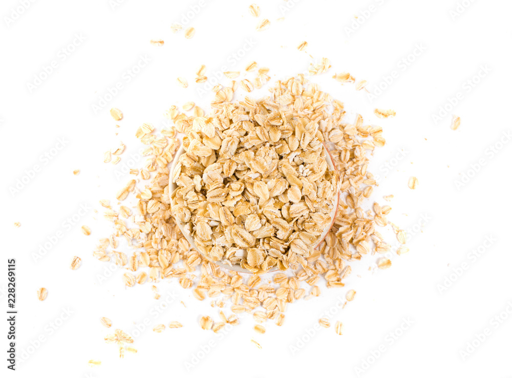 Top view of oat flakes in the cup on isolated background. Top view of oat flakes in the cup on isolated background.