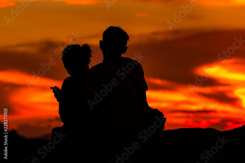 silhouette of couple enjoying sunset