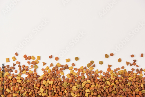 view from above of pile of dog food on white surface