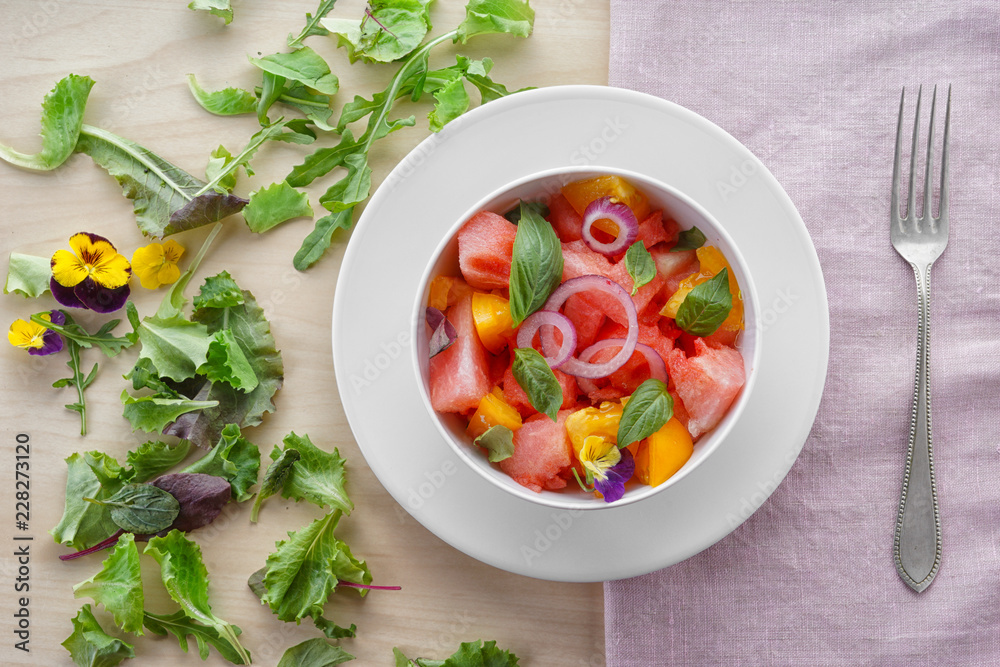 Bowl with delicious watermelon salad on table Bowl with delicious watermelon salad on table