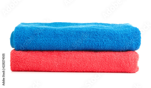 Stack of colorful towels on white background