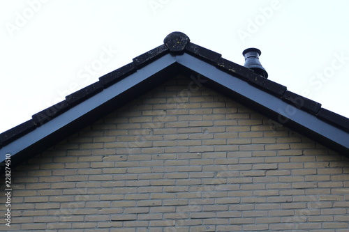 Tableau sur toile dak van woning met dakpannen