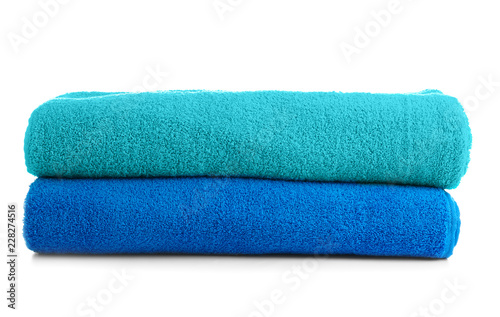 Stack of colorful towels on white background