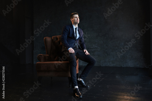 Young fashion businessman sitting on the couch