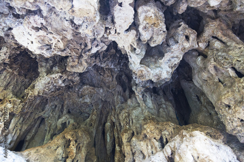 Formations inside cave with stalactites and stalagmites