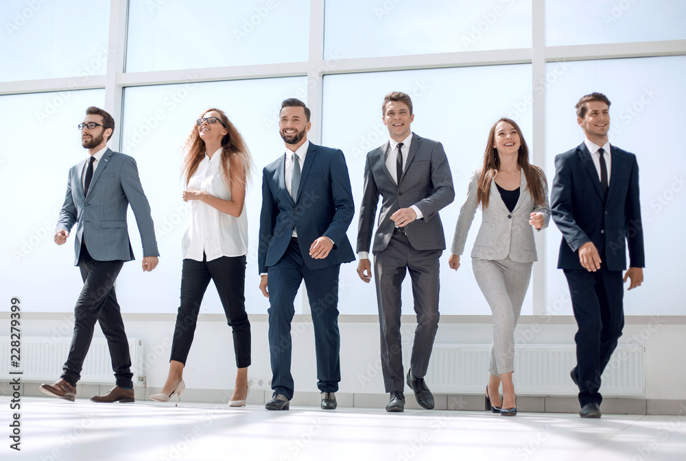 confident business team standing in spacious office