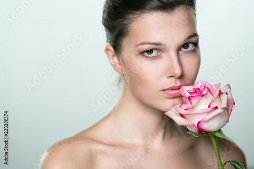beautiful young woman with rose