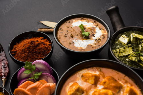 Indian Lunch / Dinner main course food in group includes Paneer Butter Masala, Dal Makhani, Palak Paneer, Roti, Rice etc, Selective focus