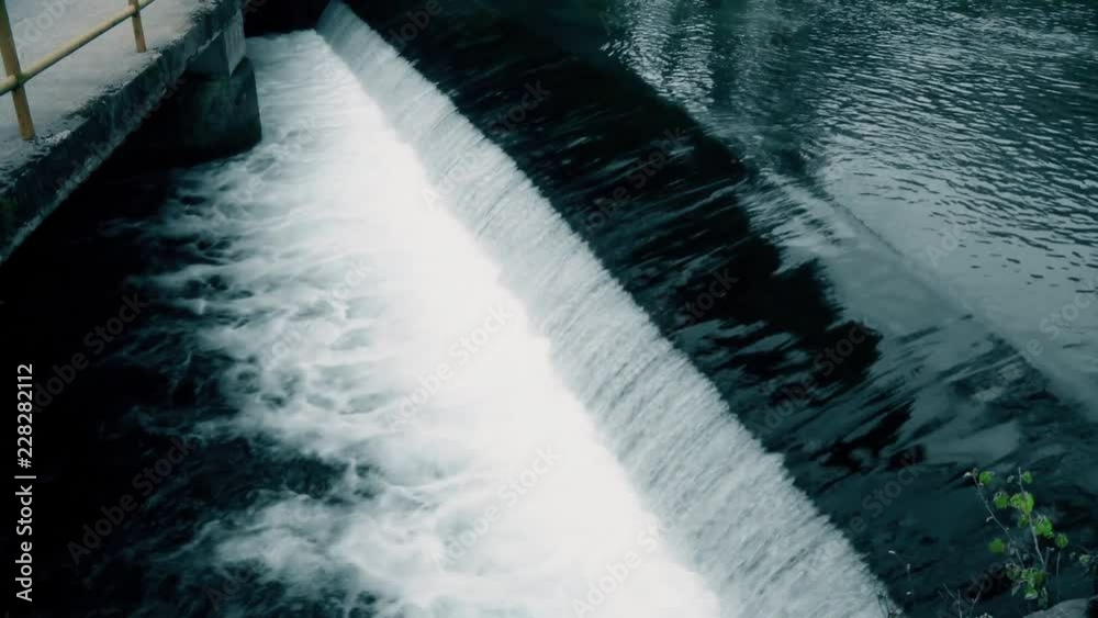 Stream water near of the bridge in city