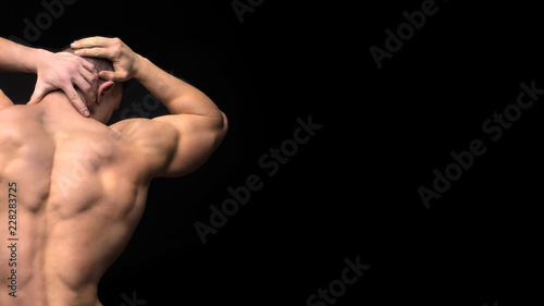 Muscular back and sexy torso of young man. Perfect back muscles and biceps