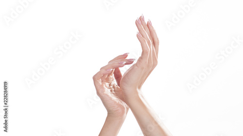 Closeup shot of beautiful woman's hands with cream, isolated on white background, Soft skin, skincare concept